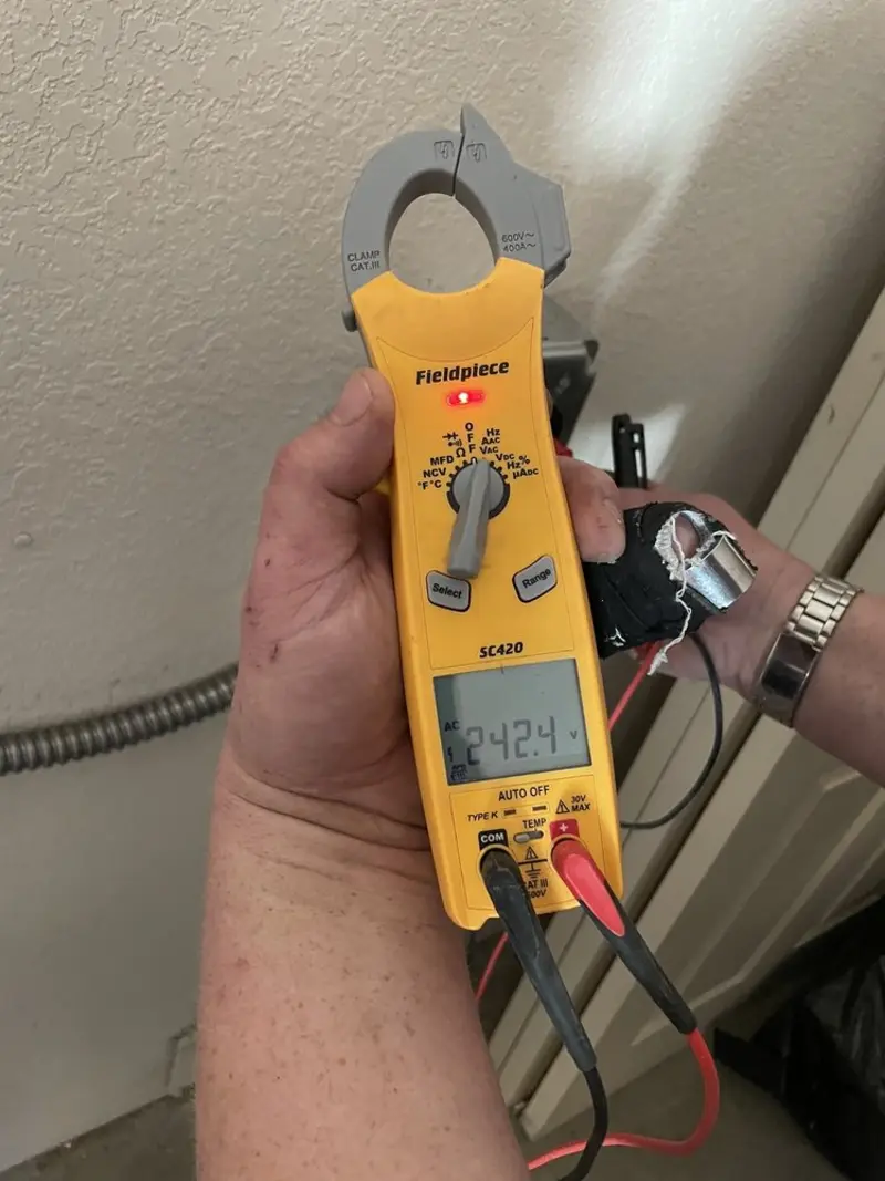 Voltage testing with clamp meter during Ceiling Fan Installation in Highland Springs
